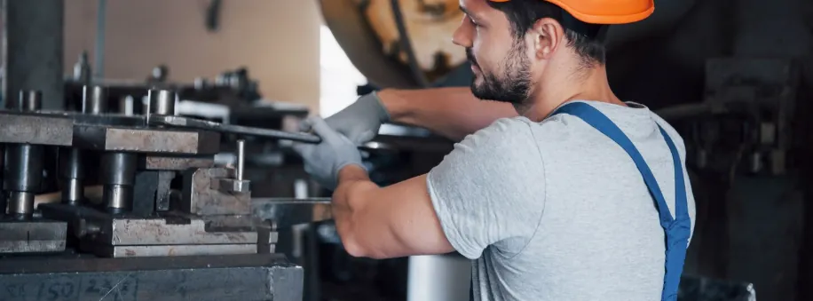 Operator setting up tooling in a press