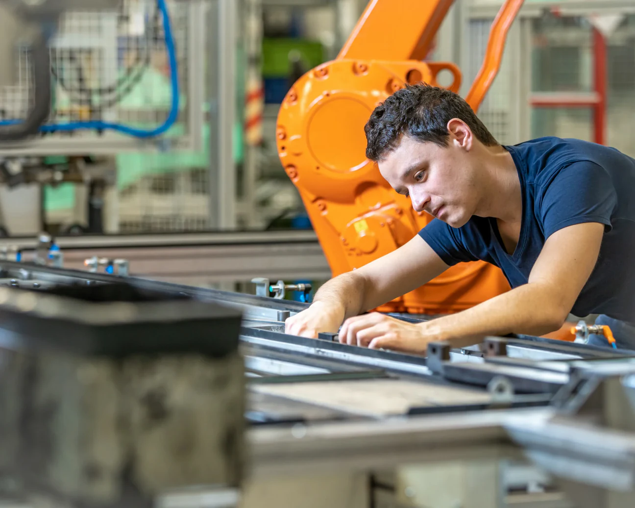 Operator working next to a robot cell